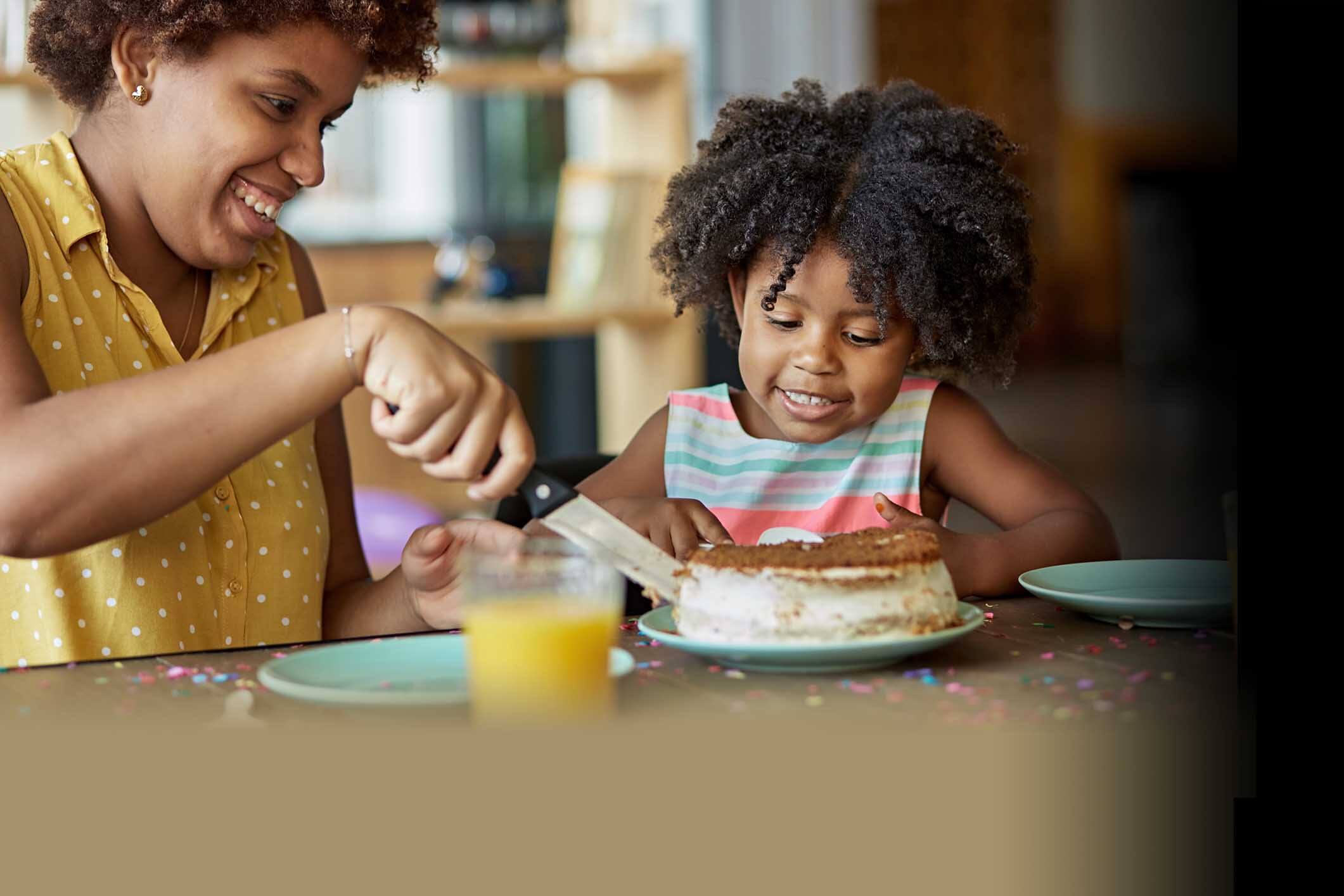 child watching cake being cut