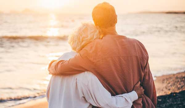 Older couple watching sunset