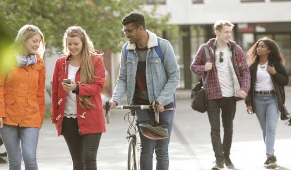 group of students walking through town