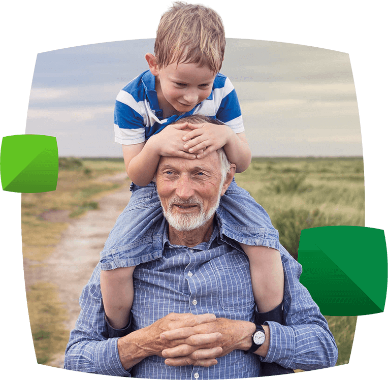 Boy on man's shoulders outside