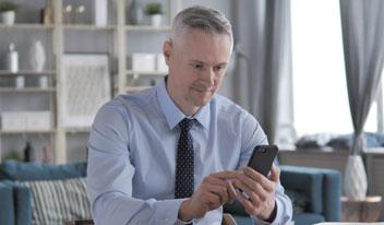 Man looking concernedly at phone